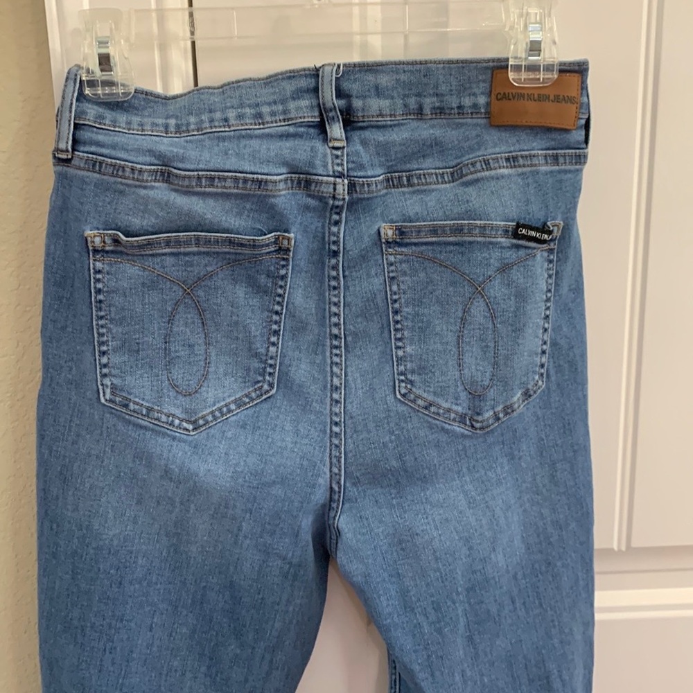 Calvin Klein blue jeans.  31